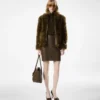 Blouson van schapenvacht met lederen details Blouson van schapenvacht met lederen details