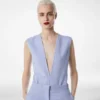 Dubbelzijdige bodysuit van lichte wol met V-hals Dubbelzijdige bodysuit van lichte wol met V-hals
