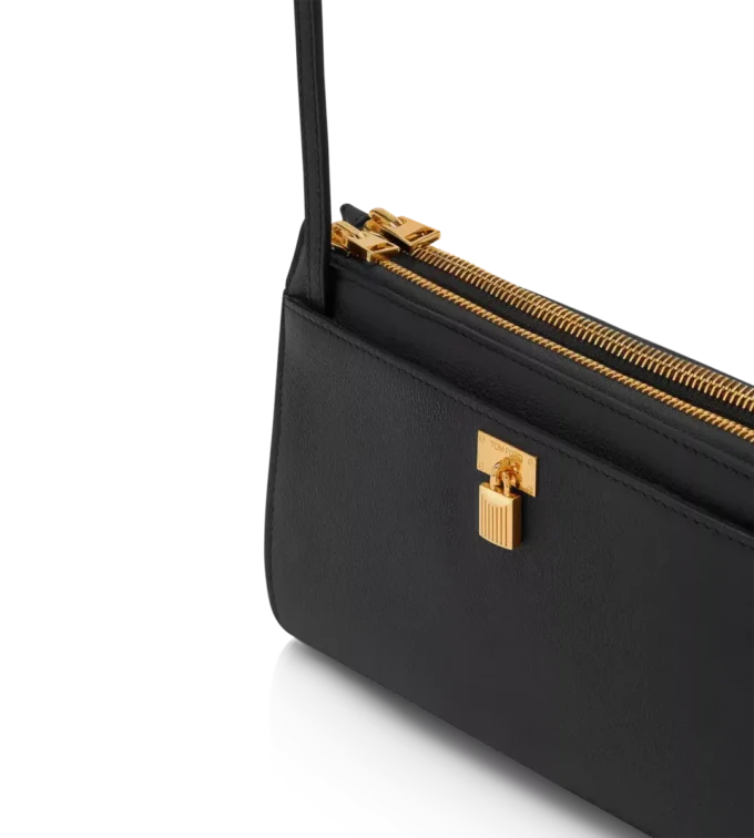 Mini-tas met hangslot van natuurlijk generfd leer met riem